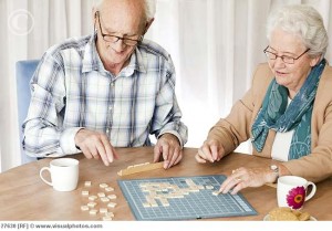A senior couple playing a board game together