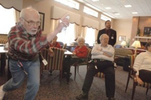 Seniors playing nintendo wii bowling