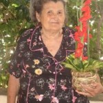 Grandmother with a plant in her hands
