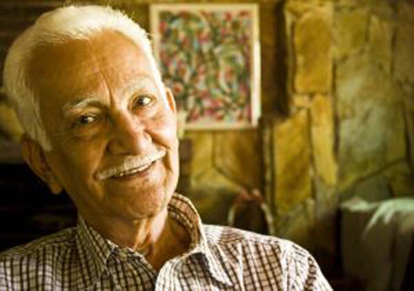 Happy elderly man in his home