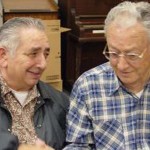 Two elderly men having a dinner together